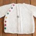 Round neck baby cardigan side fastening knitting pattern for beginners