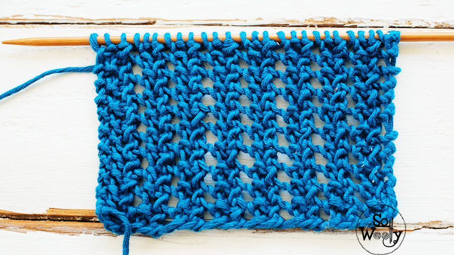 Easy lace knitting pattern (identical both sides and it doesn't roll up). So Woolly.