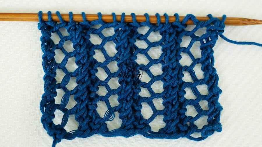 Reversible lace knitting stitch (three steps and one-row repeat pattern). So Woolly.