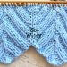 Symmetry in the Chevron stitch knitting pattern