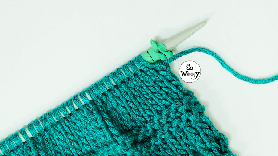 Use rubber bands to prevent stitches from slipping off the knitting needles